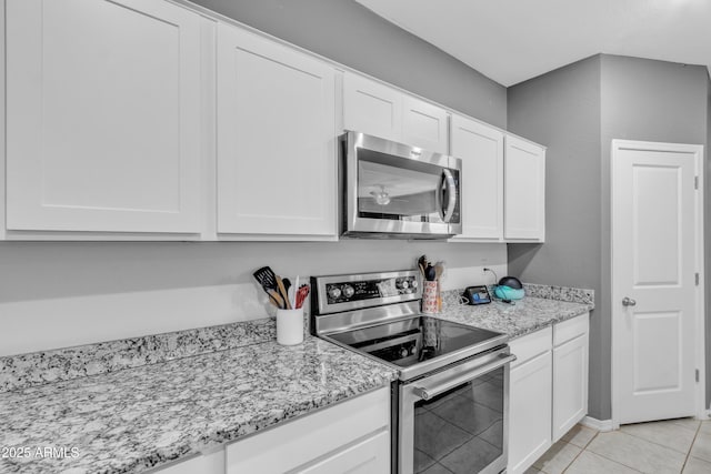 6085 E Athena Rd, Florence, AZ 85132 - kitchen with stainless steel appliances, white cabinets, and light stone counters