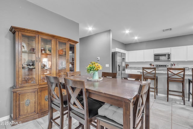 6085 E Athena Rd, Florence, AZ 85132 - dining area with light tile patterned floors and recessed lighting