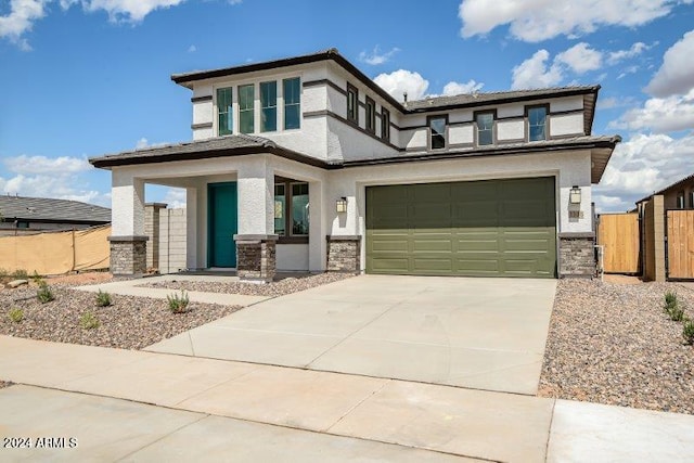 prairie-style house featuring a garage