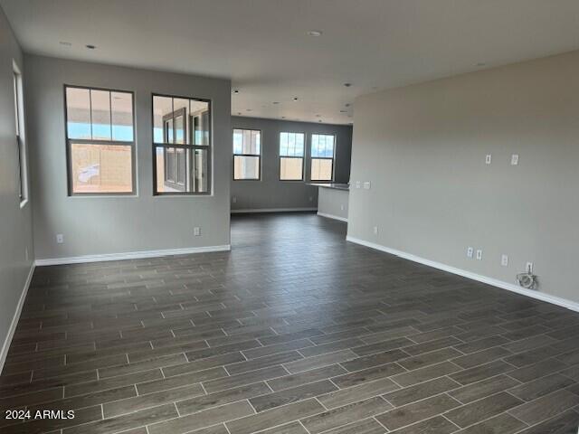 unfurnished room with dark hardwood / wood-style floors