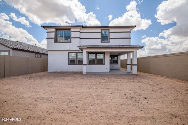 back of house featuring a patio area