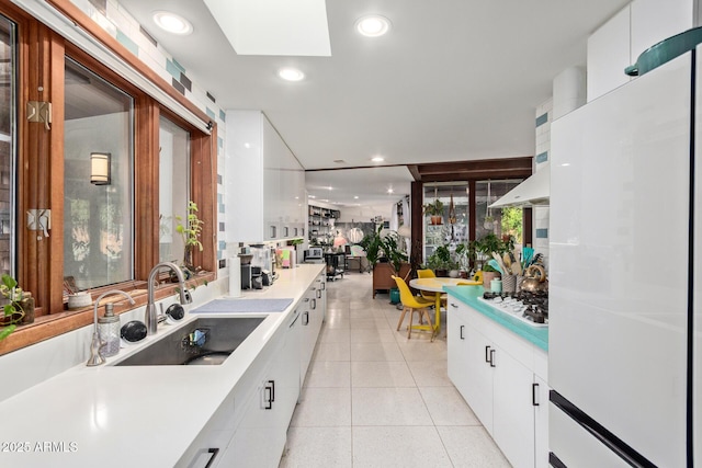 301 W Royal Palm Rd, Phoenix, AZ 85021 - kitchen with white appliances, modern cabinets, a sink, white cabinetry, and recessed lighting
