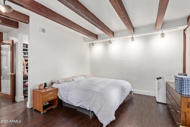 301 W Royal Palm Rd, Phoenix, AZ 85021 - bedroom featuring track lighting, beam ceiling, dark wood-type flooring, and baseboards