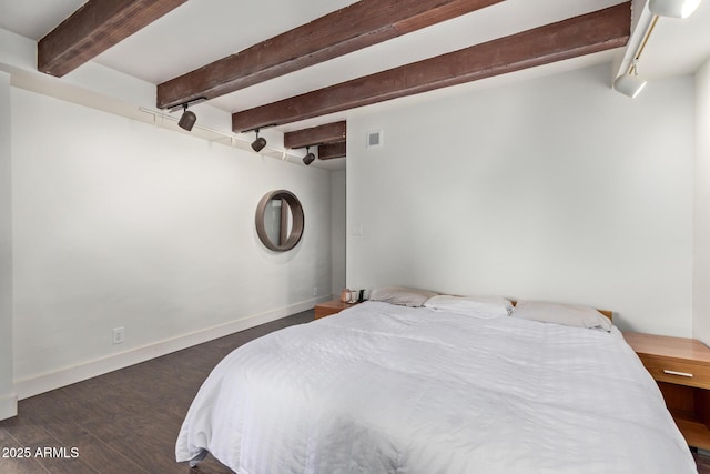 301 W Royal Palm Rd, Phoenix, AZ 85021 - bedroom featuring beamed ceiling, wood finished floors, and baseboards