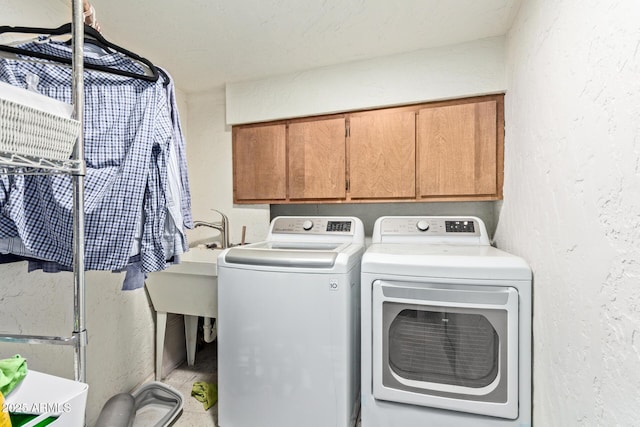 301 W Royal Palm Rd, Phoenix, AZ 85021 - laundry room with separate washer and dryer, cabinet space, and a textured wall