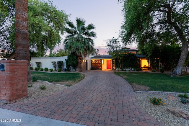 301 W Royal Palm Rd, Phoenix, AZ 85021 - view of front of house with decorative driveway and a garage