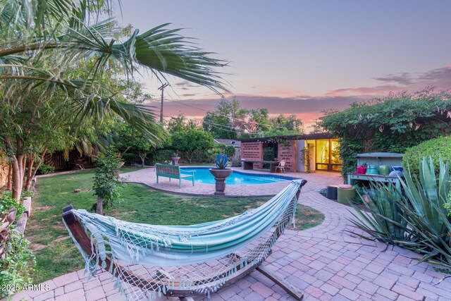 301 W Royal Palm Rd, Phoenix, AZ 85021 - view of swimming pool featuring a patio and a lawn