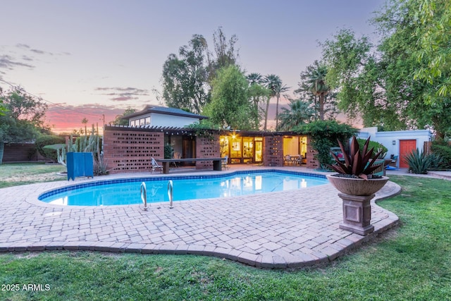 301 W Royal Palm Rd, Phoenix, AZ 85021 - pool at dusk with a patio, an outdoor pool, and a yard