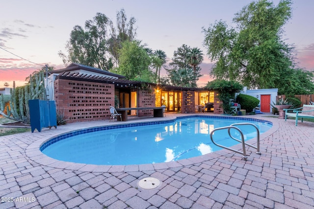 301 W Royal Palm Rd, Phoenix, AZ 85021 - pool at dusk with an outdoor pool and a patio
