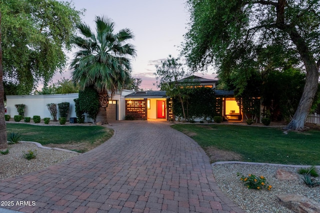 301 W Royal Palm Rd, Phoenix, AZ 85021 - view of front of property with decorative driveway and a garage
