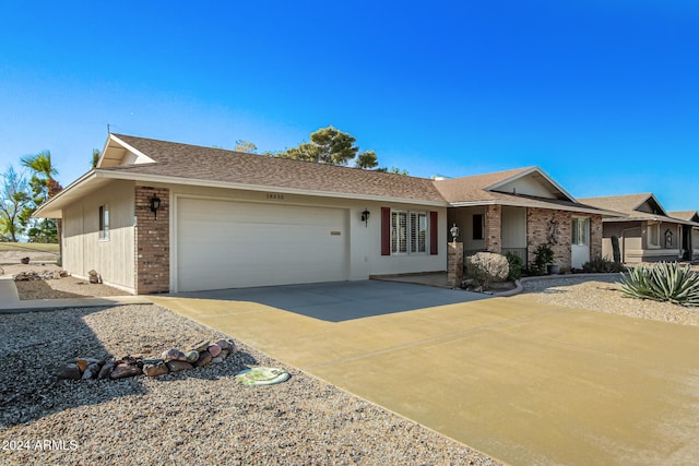 single story home featuring a garage