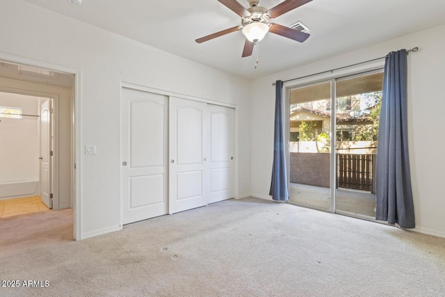 unfurnished bedroom with a closet, visible vents, light carpet, access to outside, and baseboards