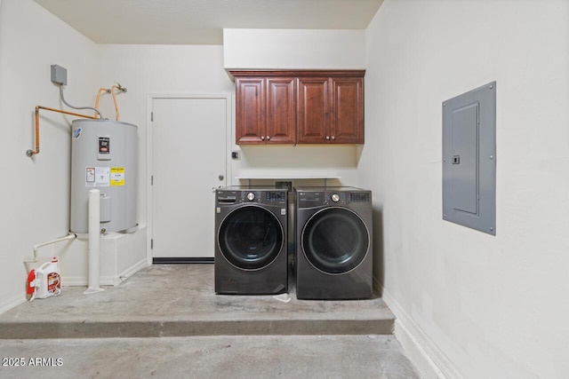 laundry area with baseboards, water heater, independent washer and dryer, cabinet space, and electric panel