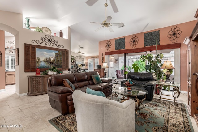 living room with ceiling fan and lofted ceiling