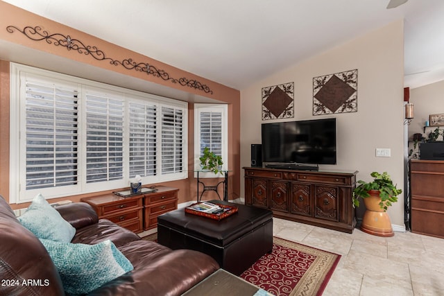 living room featuring lofted ceiling