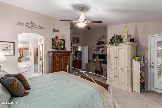 carpeted bedroom featuring ensuite bathroom and ceiling fan