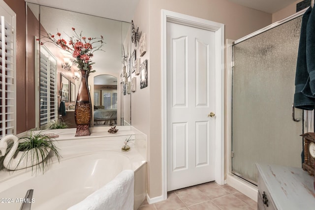 bathroom with tile patterned flooring and plus walk in shower