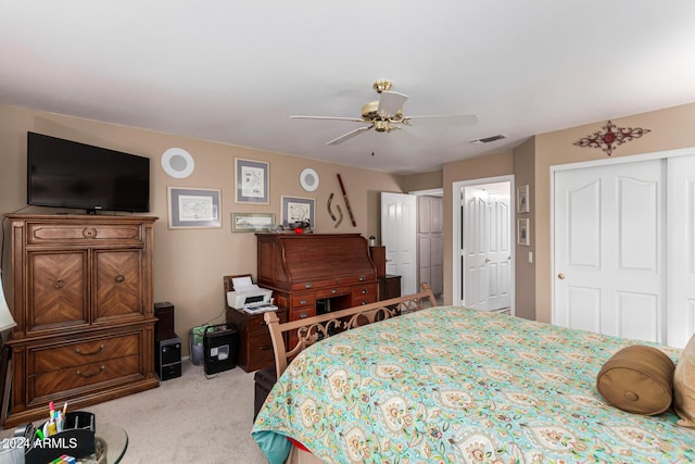 bedroom with ceiling fan and light carpet