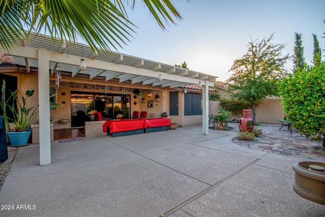 patio terrace at dusk with a pergola