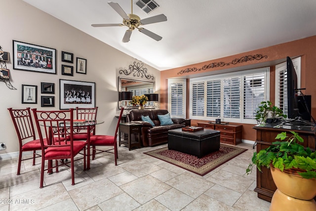 living room with ceiling fan and lofted ceiling