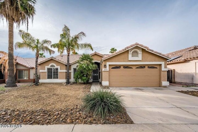 view of front of property with a garage