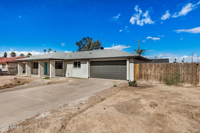 ranch-style house featuring a garage