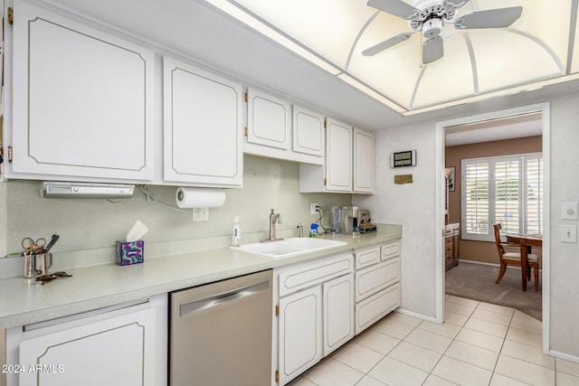 kitchen with ceiling fan, white cabinetry, dishwasher, sink, and light tile patterned flooring