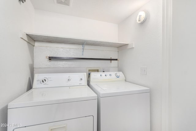 clothes washing area with hookup for a washing machine and separate washer and dryer