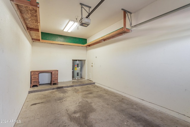 garage featuring a garage door opener and water heater