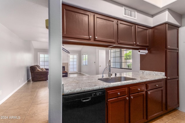 kitchen with sink, light tile flooring, and dishwasher