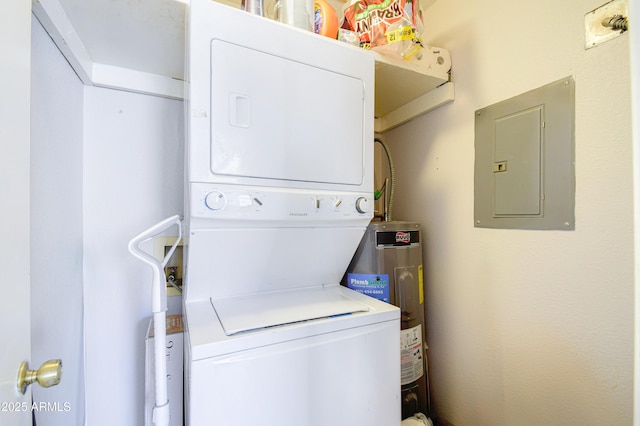 laundry area with water heater, stacked washer and clothes dryer, and electric panel