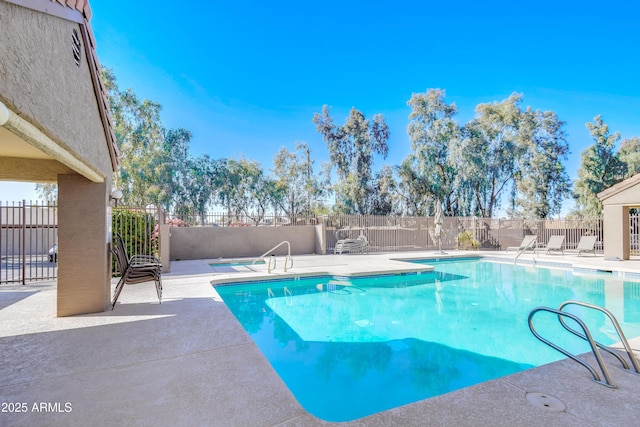 view of pool featuring a patio