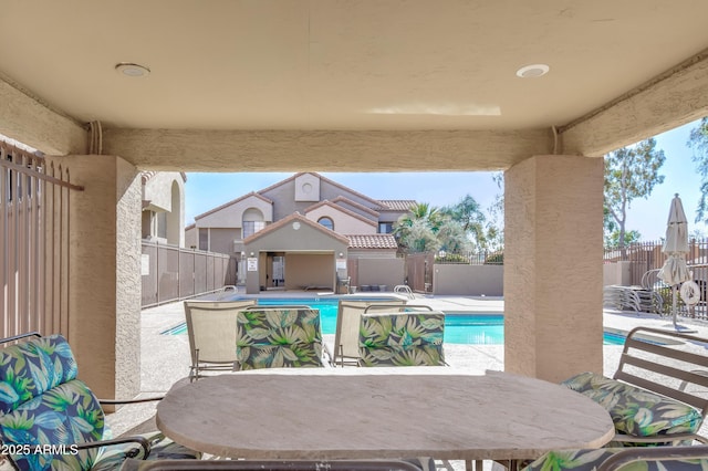 exterior space with a pool with hot tub