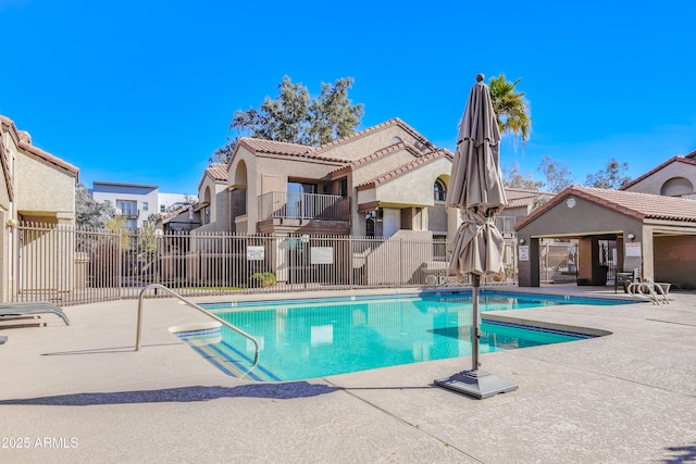 view of swimming pool with a patio