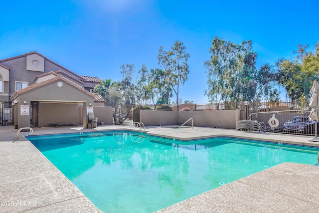 view of swimming pool with a patio area