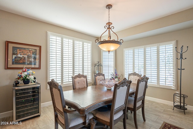 dining area with a healthy amount of sunlight and wine cooler