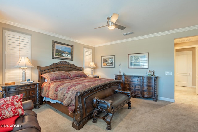 carpeted bedroom with ceiling fan and crown molding