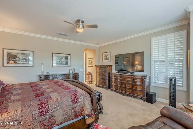 carpeted bedroom featuring ceiling fan and ornamental molding