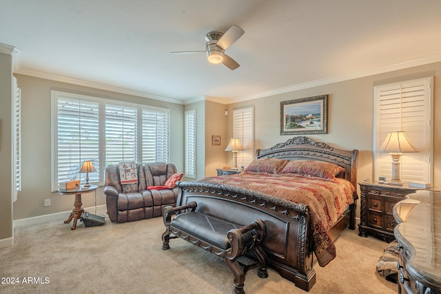 carpeted bedroom with ceiling fan and ornamental molding