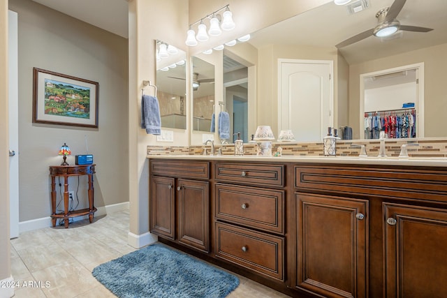 bathroom featuring tile patterned floors, ceiling fan, and vanity