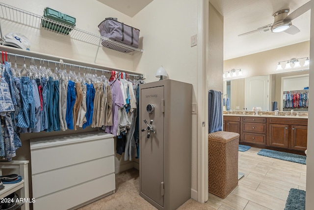 walk in closet featuring ceiling fan and sink