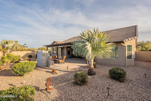 rear view of house with a patio