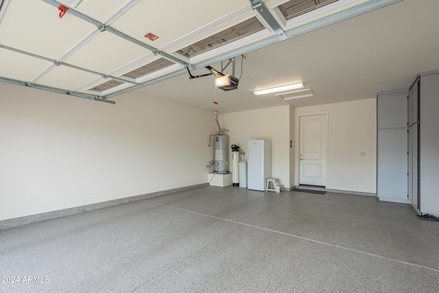 garage featuring gas water heater and a garage door opener