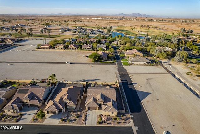 birds eye view of property with a mountain view