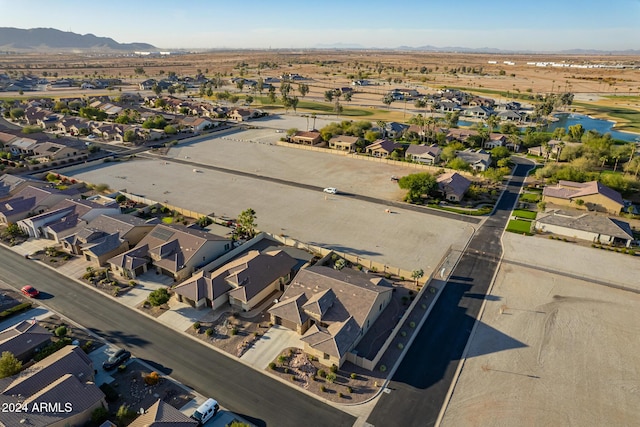 birds eye view of property with a mountain view