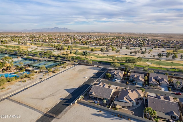 birds eye view of property with a mountain view