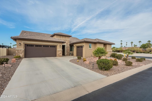 prairie-style home featuring a garage