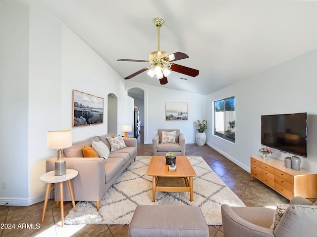 living room featuring tile patterned flooring, ceiling fan, and lofted ceiling