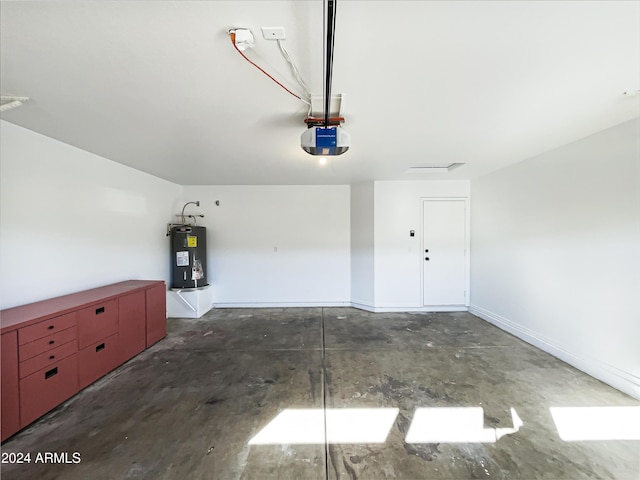 garage featuring electric water heater and a garage door opener