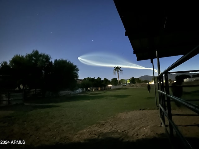 view of yard at dusk